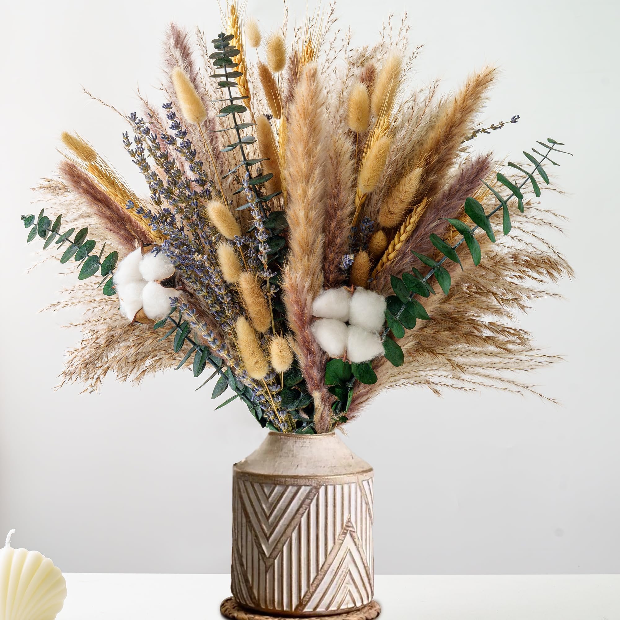 Dried flower bouquet with pampas grass, lavender, eucalyptus, and cotton in a decorative vase.