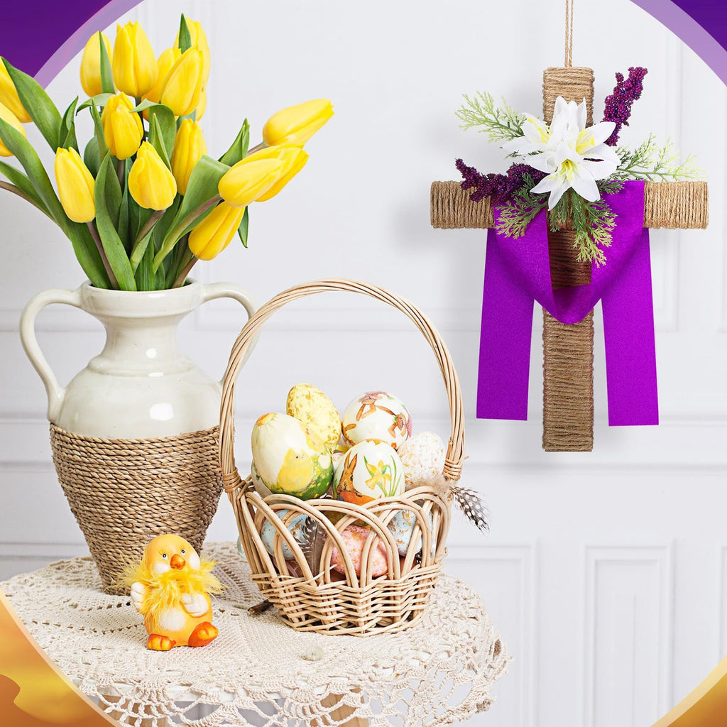 Easter cross wreath with purple ribbon and white lilies, next to a basket of decorated eggs and yellow tulips.