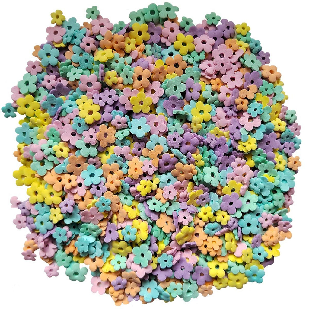 Pile of edible pastel flower-shaped sprinkles for cake and dessert decoration