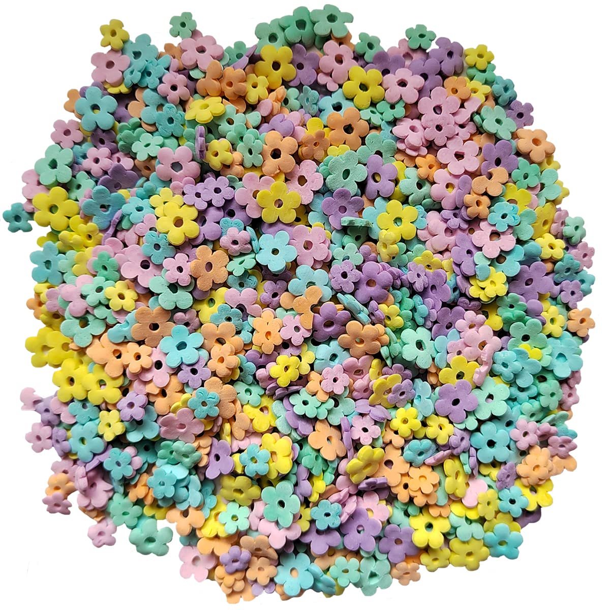 Pile of edible pastel flower-shaped sprinkles for cake and dessert decoration