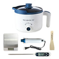 Candle making kit including a white wax melter pot, digital scale, heat gun, thermometer, and wooden stirrer on a white background.