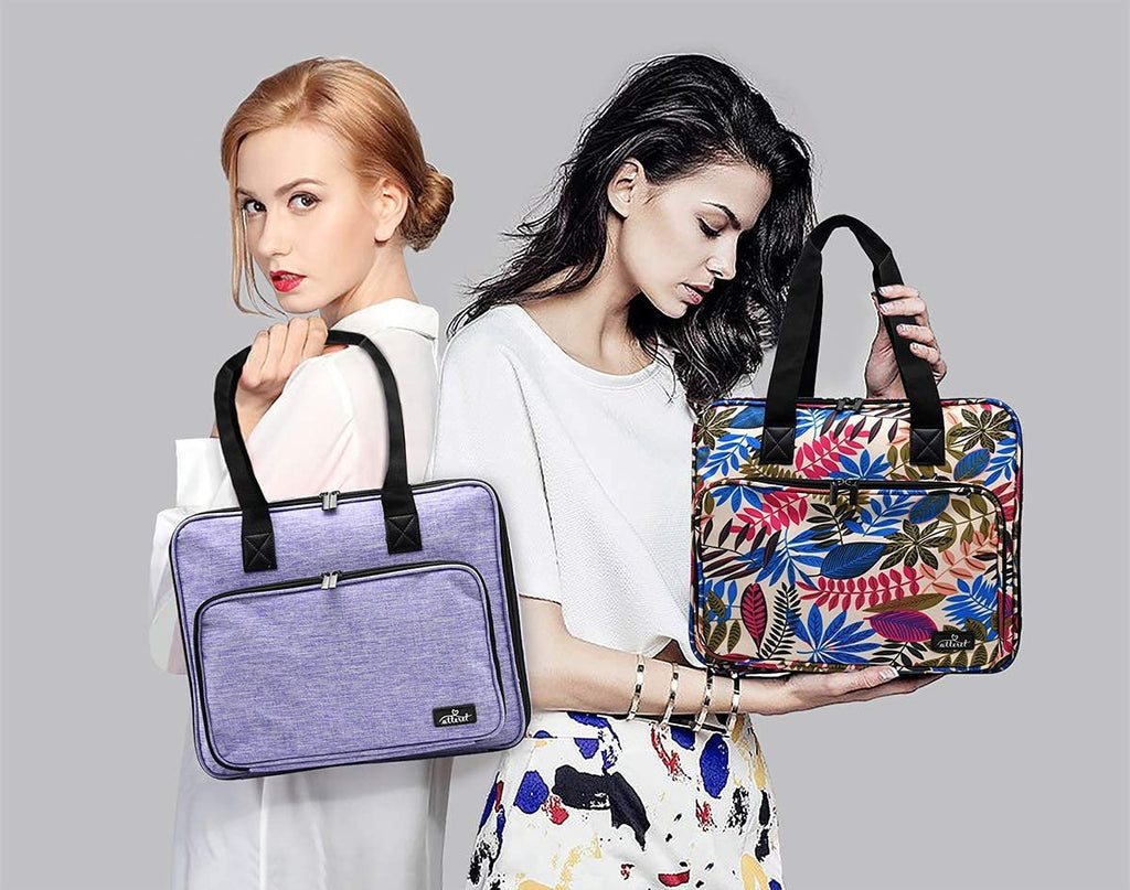 Two women holding embroidery and cross stitch storage organizer bags, one purple and one floral print