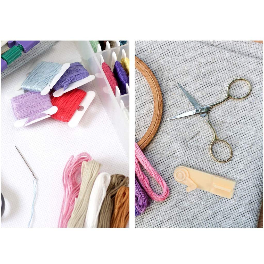 Embroidery floss organizer with bobbins, scissors, needle, and embroidery hoop on fabric