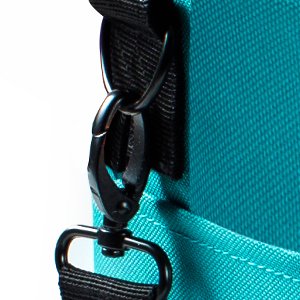 Close-up of a teal crochet tote bag strap hardware and textured fabric.