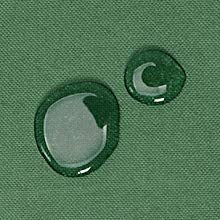 Two water droplets on green fabric, demonstrating water resistance.