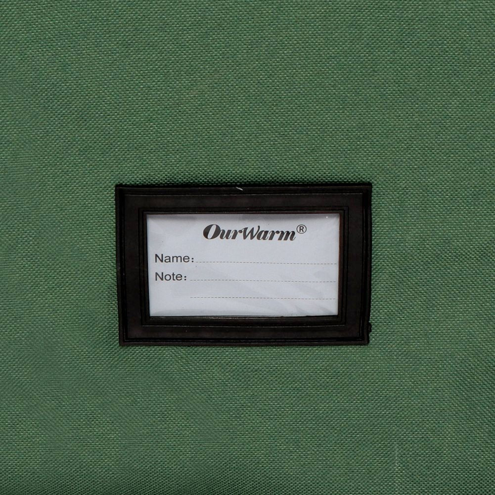 Green Christmas tree storage bag with a label for name and note, featuring brand name.