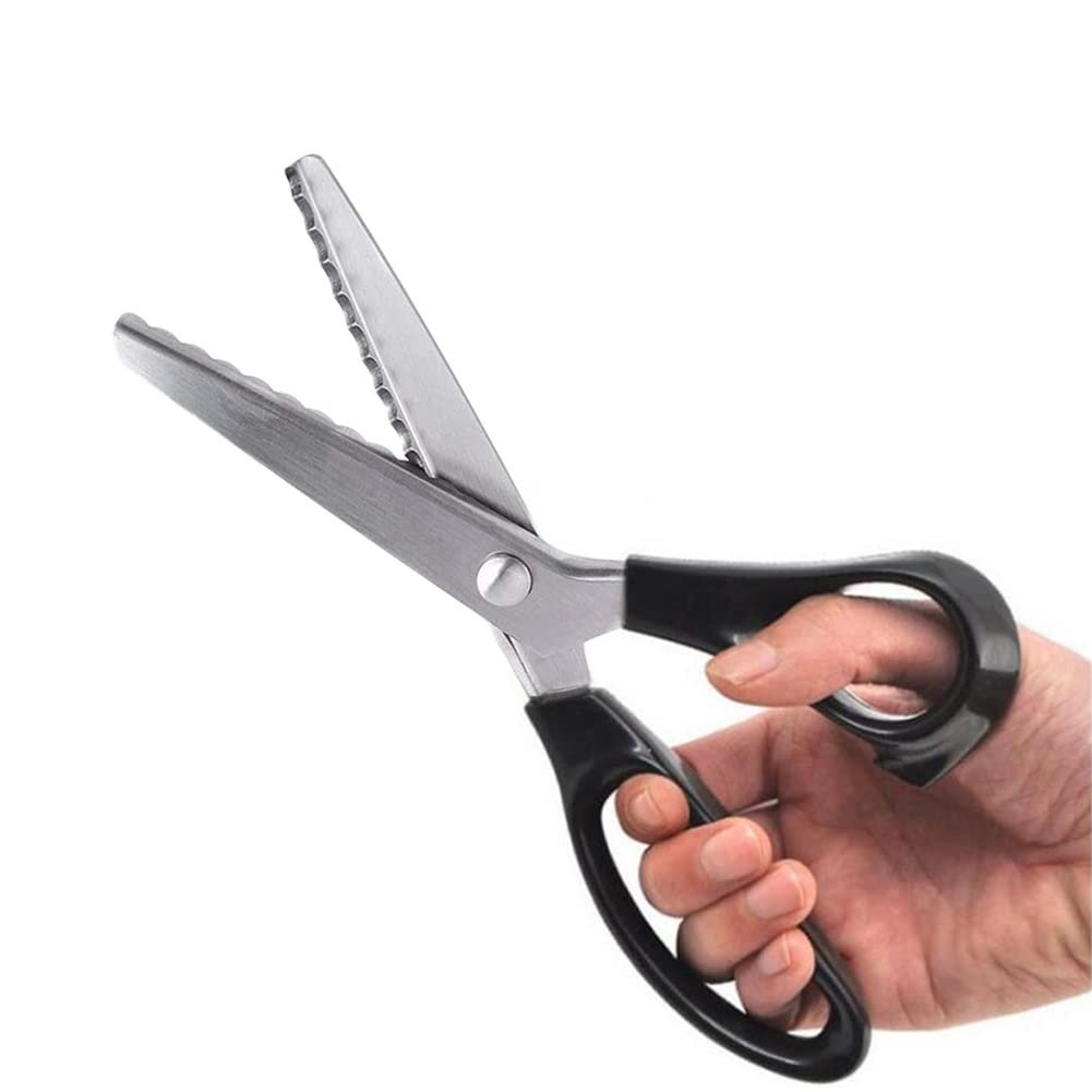 Hand holding fabric pinking shears with stainless steel scalloped blades and black ergonomic handles