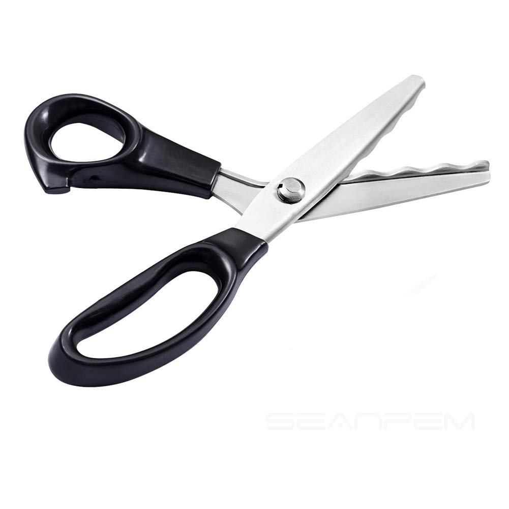 Fabric pinking shears with black ergonomic handles and stainless steel scalloped blades, angled view on white background.