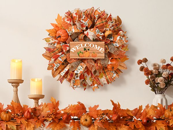 Fall mesh wreath with pumpkins and leaves, featuring a wooden sign that says WELCOME.