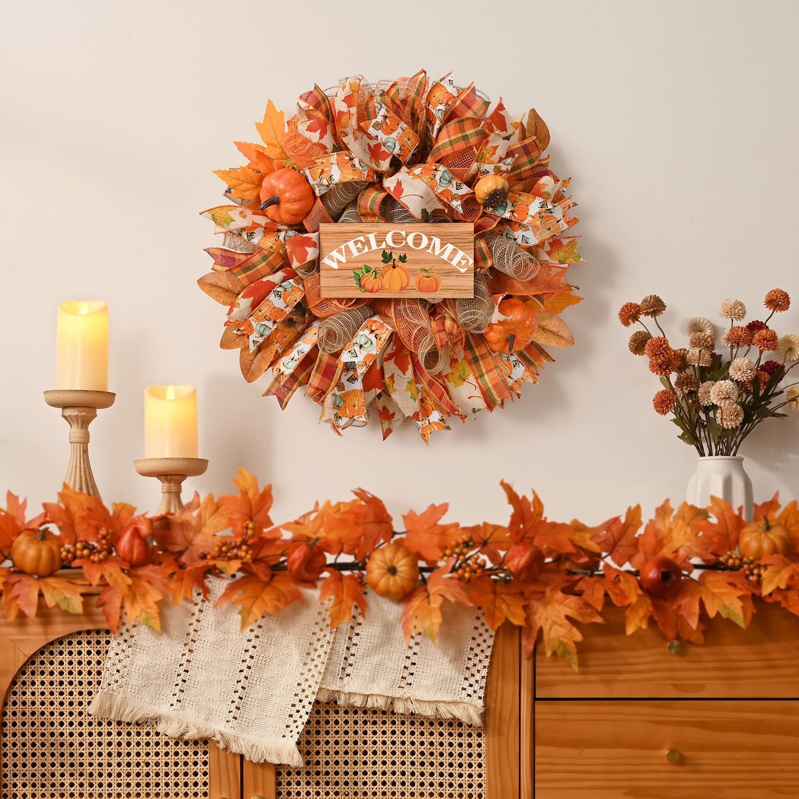 Fall mesh wreath with wooden welcome sign and pumpkins, decorated with autumn leaves and plaid ribbons.
