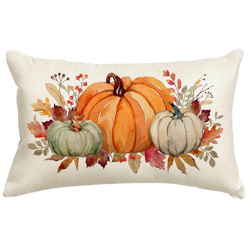 Lumbar pillow cover with watercolor pumpkins and autumn leaves design on a textured background.