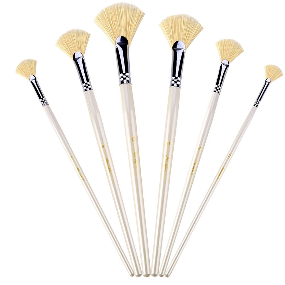 Set of six fan paint brushes with natural bristles and long wooden handles, arranged in a fan shape on a white background.