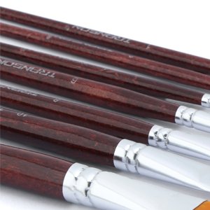 Close-up of seven flat paint brushes with dark wood handles, showing bristles and ferrules.