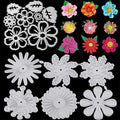 Collection of metal cutting dies in flower and snowflake shapes, alongside colorful paper flower embellishments on a black background.