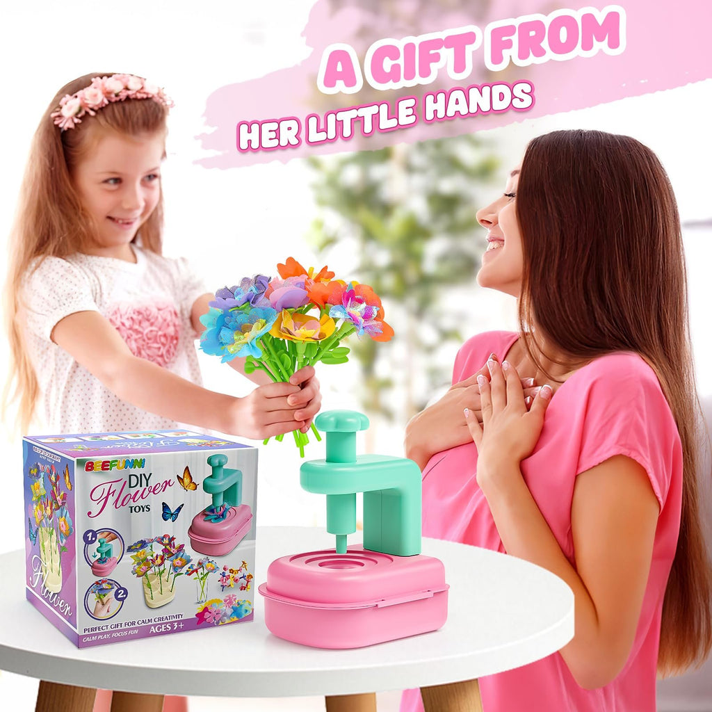 Girl presents a bouquet of colorful craft flowers to a smiling woman, with the craft kit box and tool on a table.
