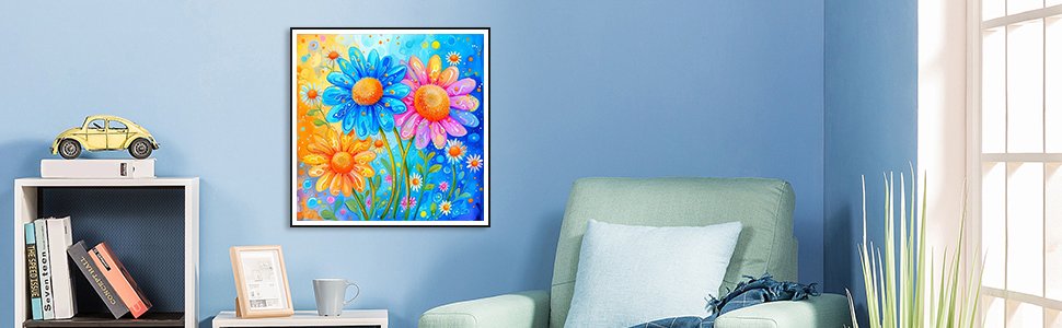 Colorful diamond painting of three daisies hanging on a blue wall above a bookshelf and armchair.