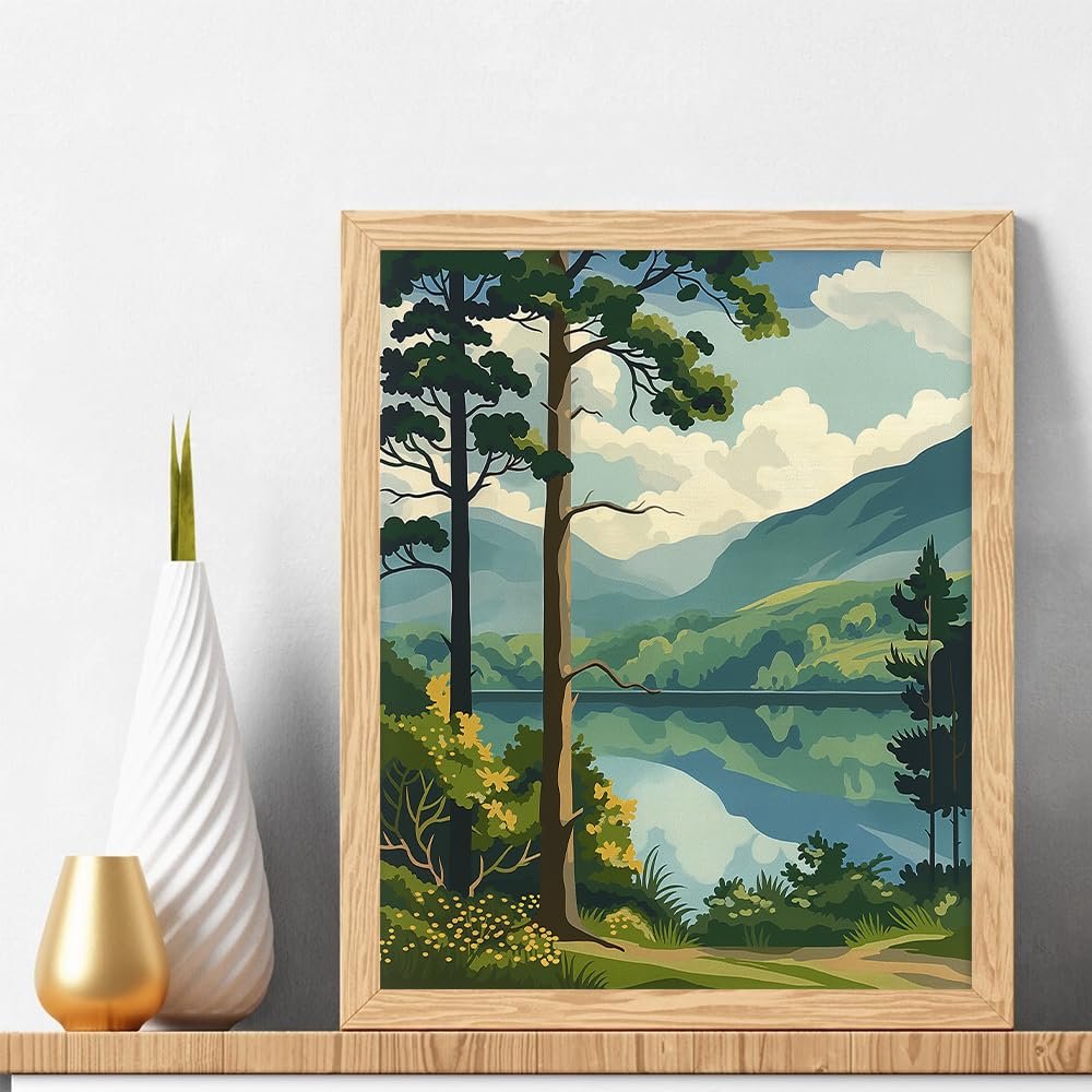 Framed forest landscape painting with a lake and mountains, displayed on a shelf next to decorative vases.