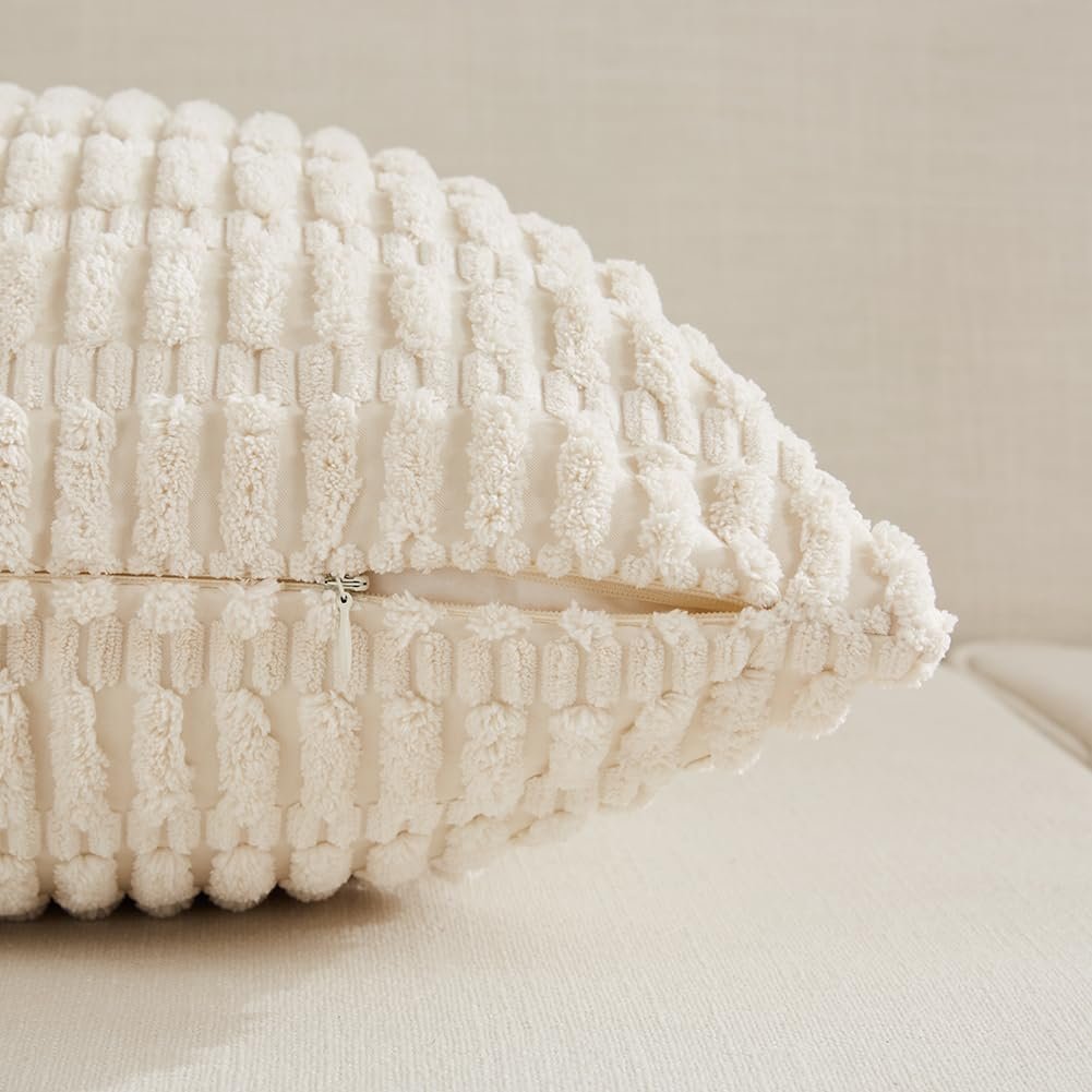 Close-up of a textured cream throw pillow cover showing its hidden zipper closure.