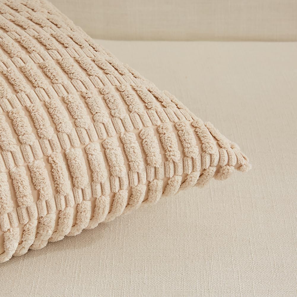 Close-up of a textured beige throw pillow cover with a ribbed pattern, resting on a neutral sofa.