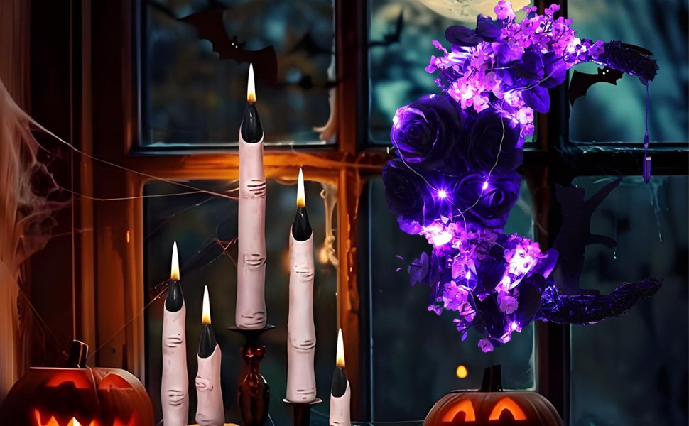 Halloween wreath with purple flowers and lights, finger candles, and jack-o-lanterns on a windowsill with bats and spiderwebs.
