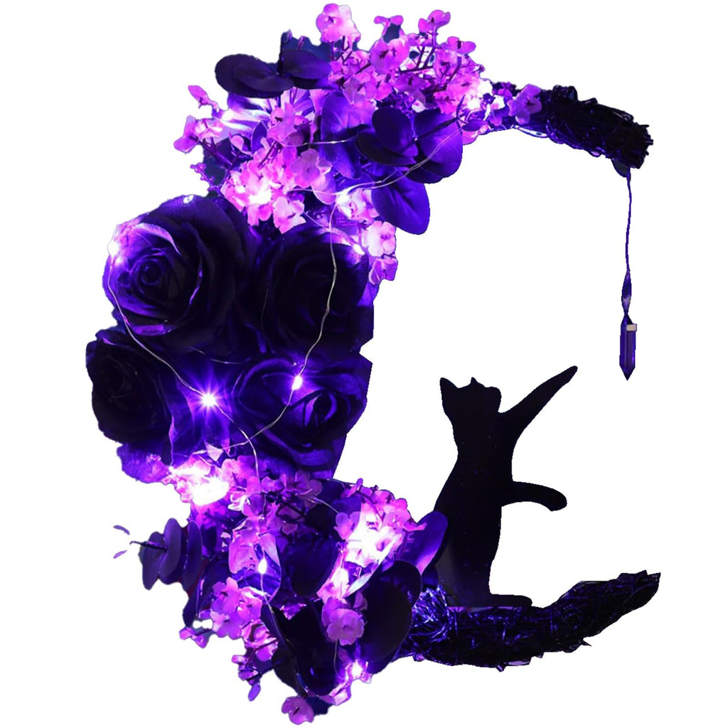 Halloween wreath with black cat silhouette reaching for a crystal, adorned with purple roses, flowers, greenery, and fairy lights on a white background.