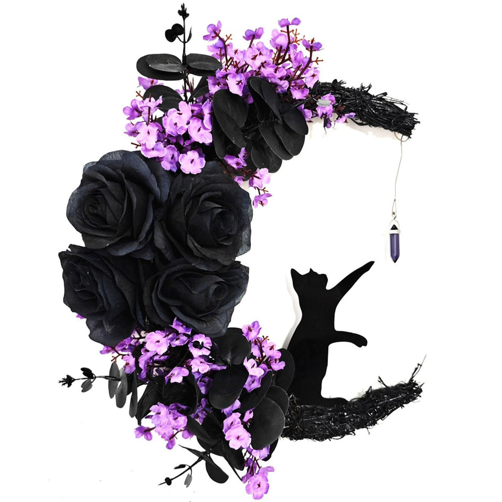 Halloween crescent moon wreath with black cat silhouette, black roses, purple flowers, and hanging crystal.