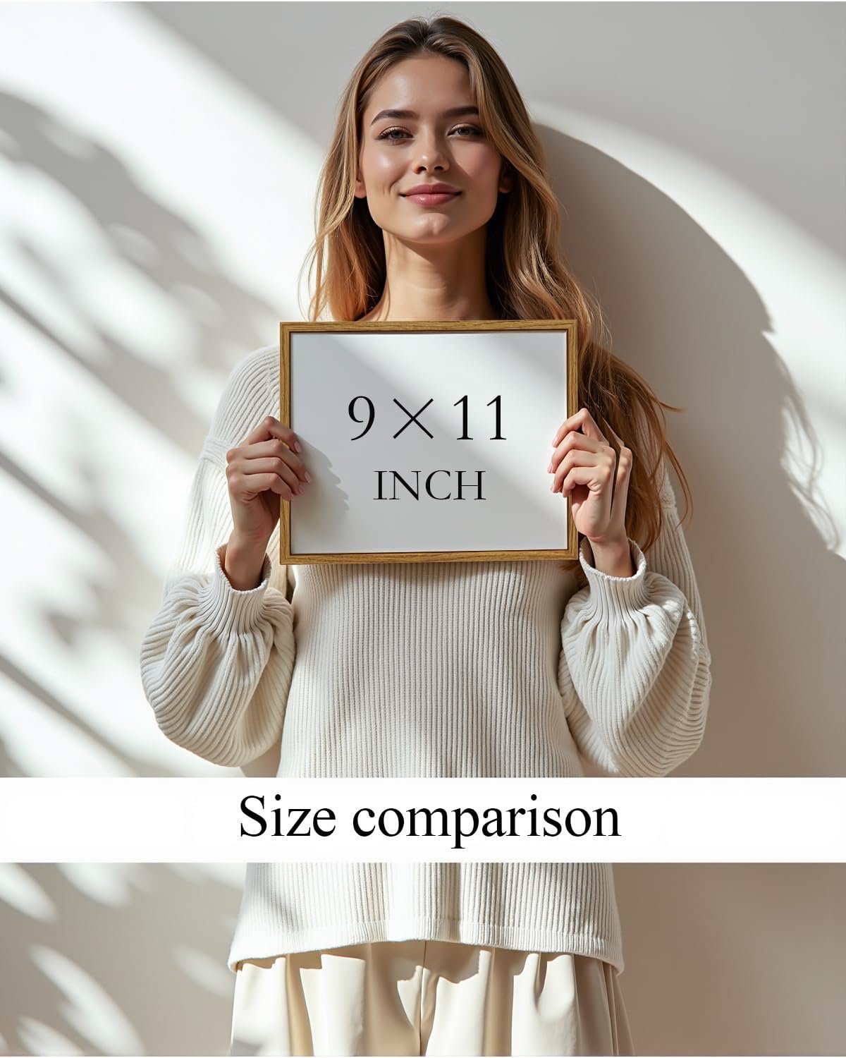 Woman holding a framed sign showing 9x11 inches for size comparison