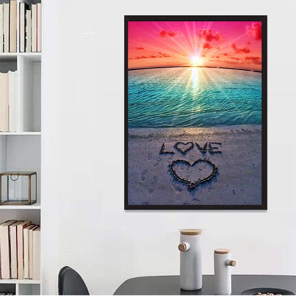 Diamond painting kit showing a beach sunset with 'LOVE' and a heart drawn in the sand.