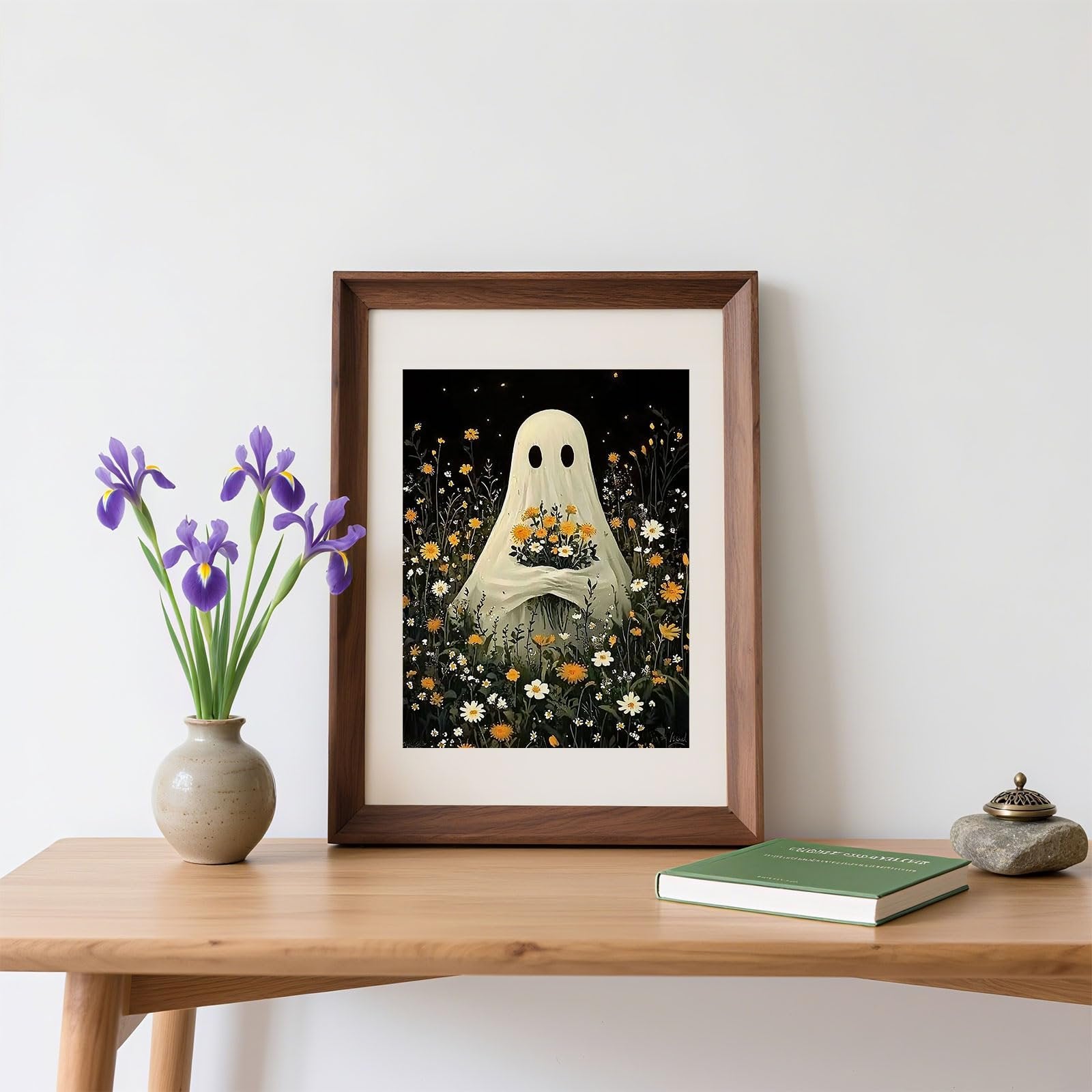 Framed ghost flower diamond painting kit artwork displayed on a wooden table with flowers and a book