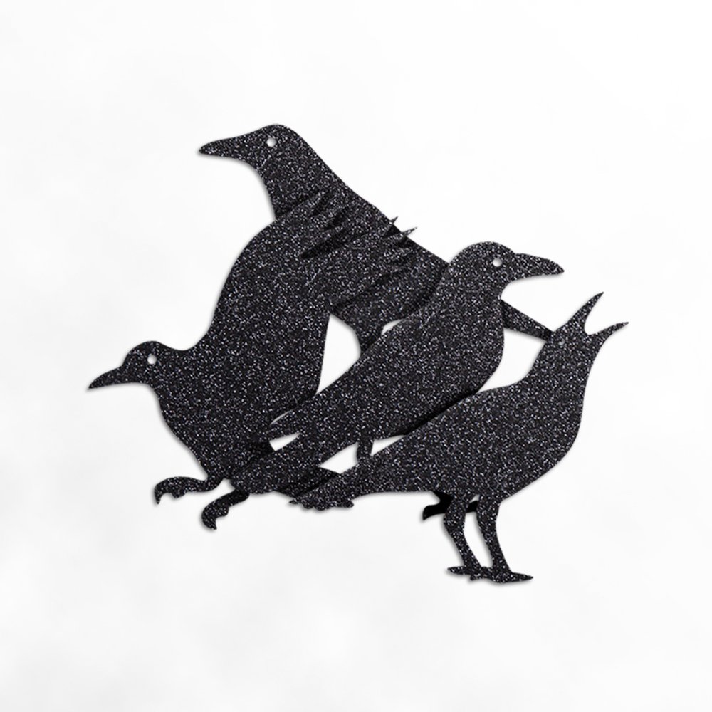 Glitter black crow garland decoration on a white background, showing four crow silhouettes.