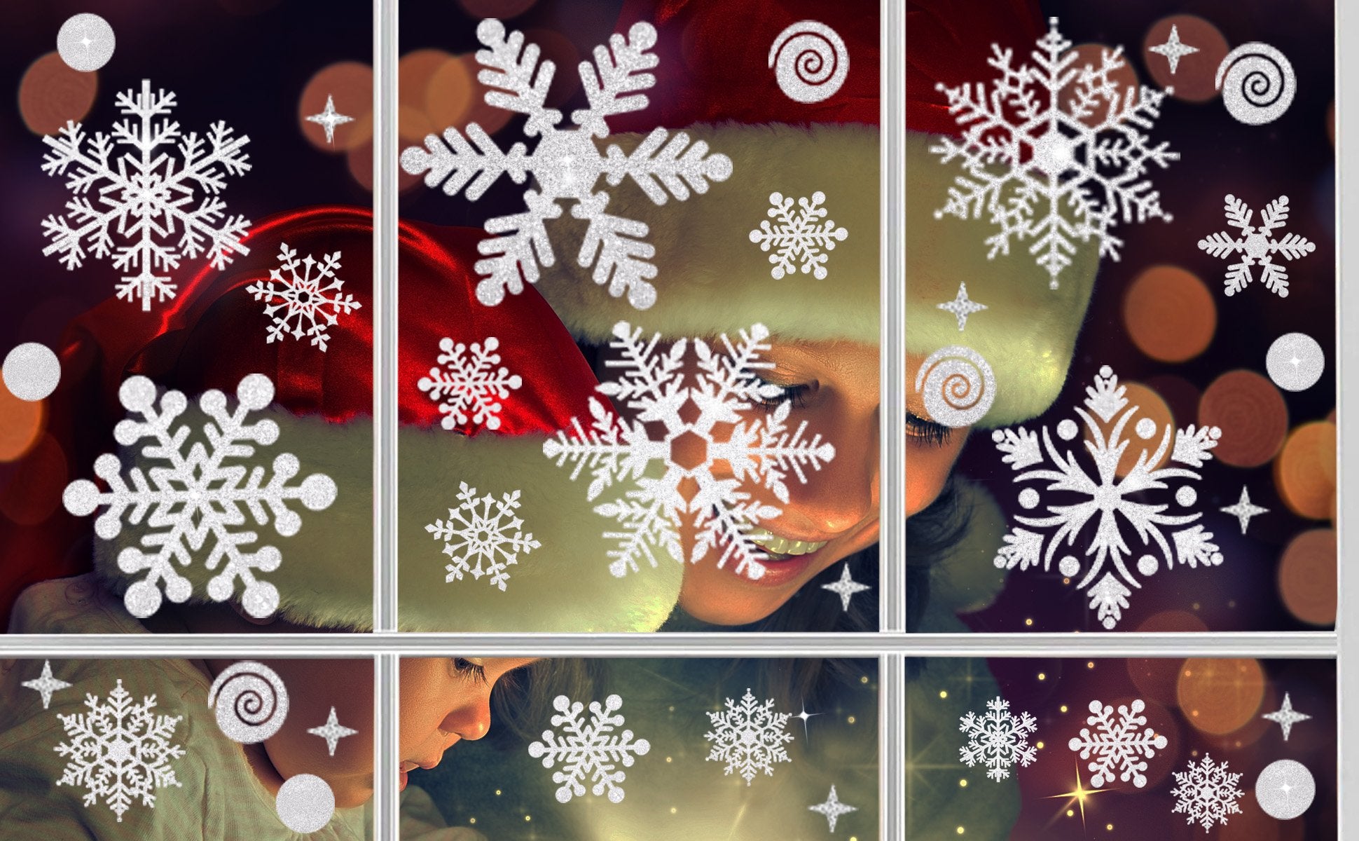 Glitter snowflake window clings on a window with blurred festive lights and people wearing Santa hats.