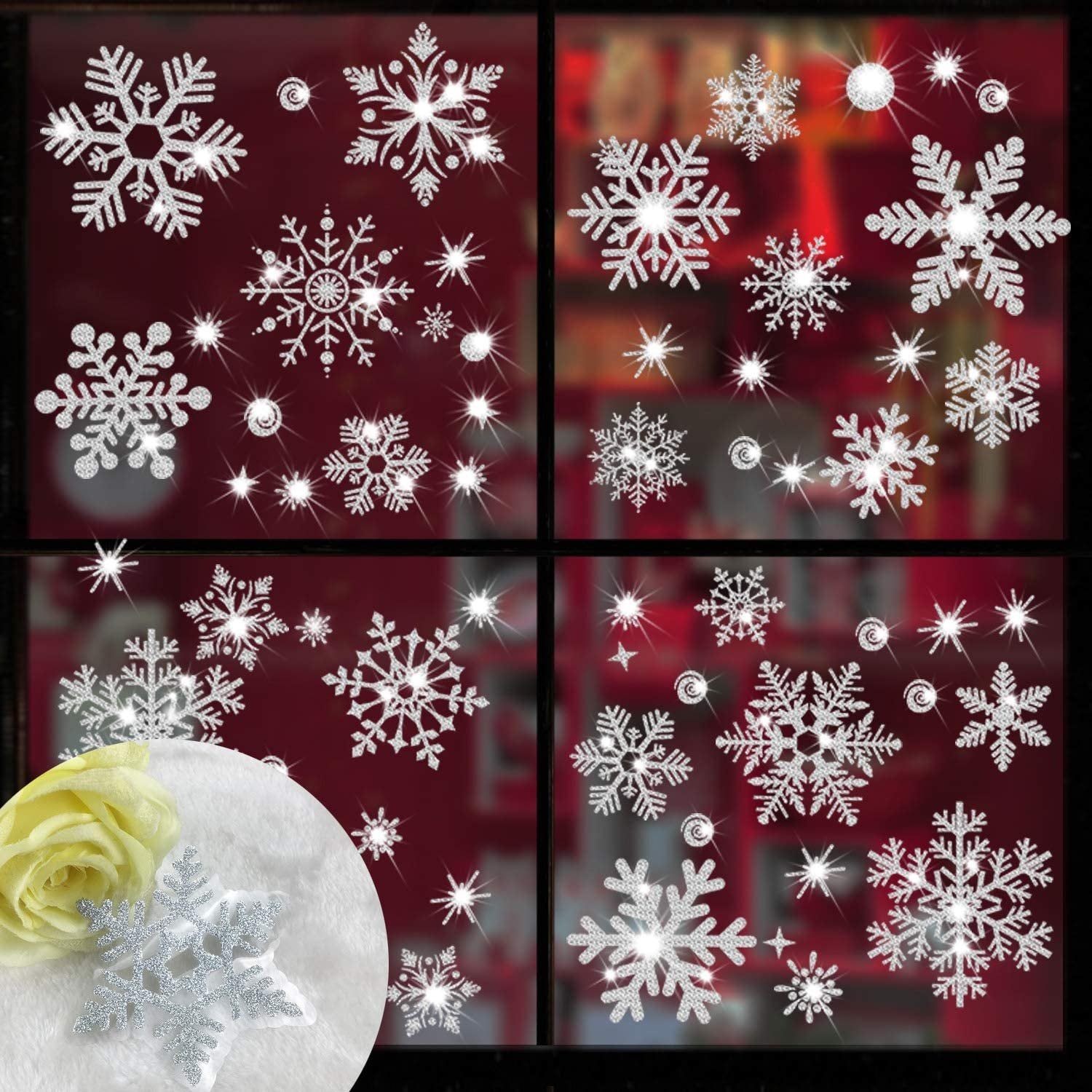 Glitter snowflake window clings on a dark red background, with a close-up of a snowflake and yellow rose in the lower left corner.