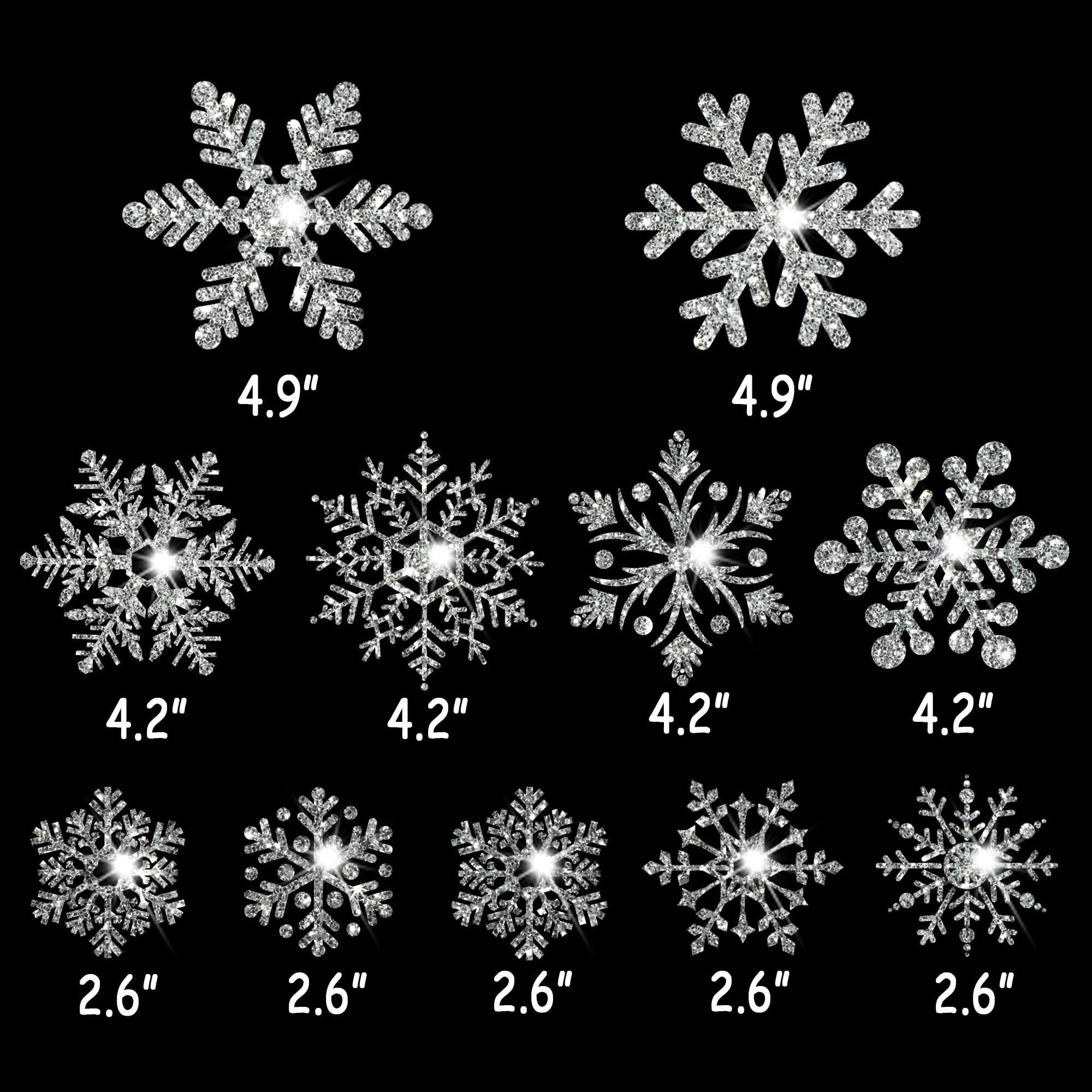 Various sizes of silver glitter snowflake window clings displayed against a black background, with dimensions labeled.