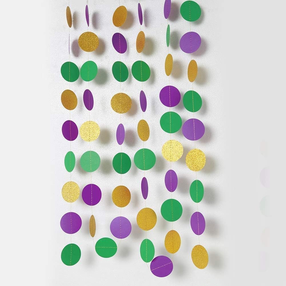 Gold, purple, and green glitter circle garland strands hanging against a white background.