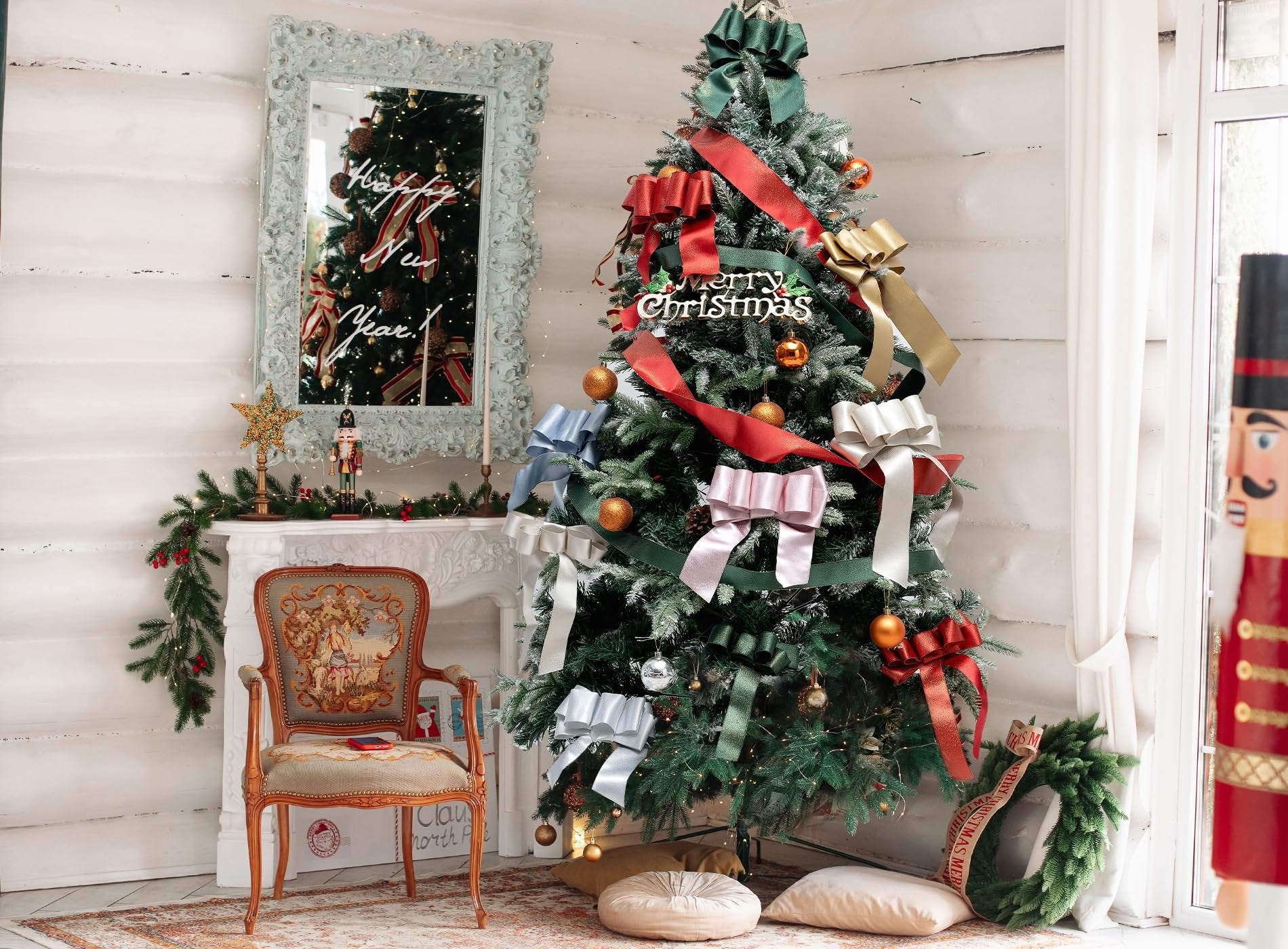 Decorated Christmas tree with various colored ribbons and ornaments, a fireplace, and a chair.