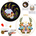 Embroidery starter kits with two hoops, one with a skull and floral design, the other with a moth and floral design, plus embroidery floss and needles.