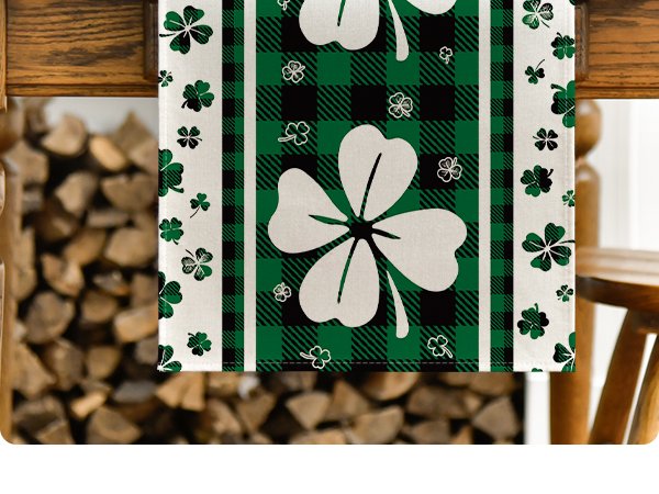 Green clover buffalo plaid St. Patrick's Day table runner with shamrocks, shown draped over furniture.