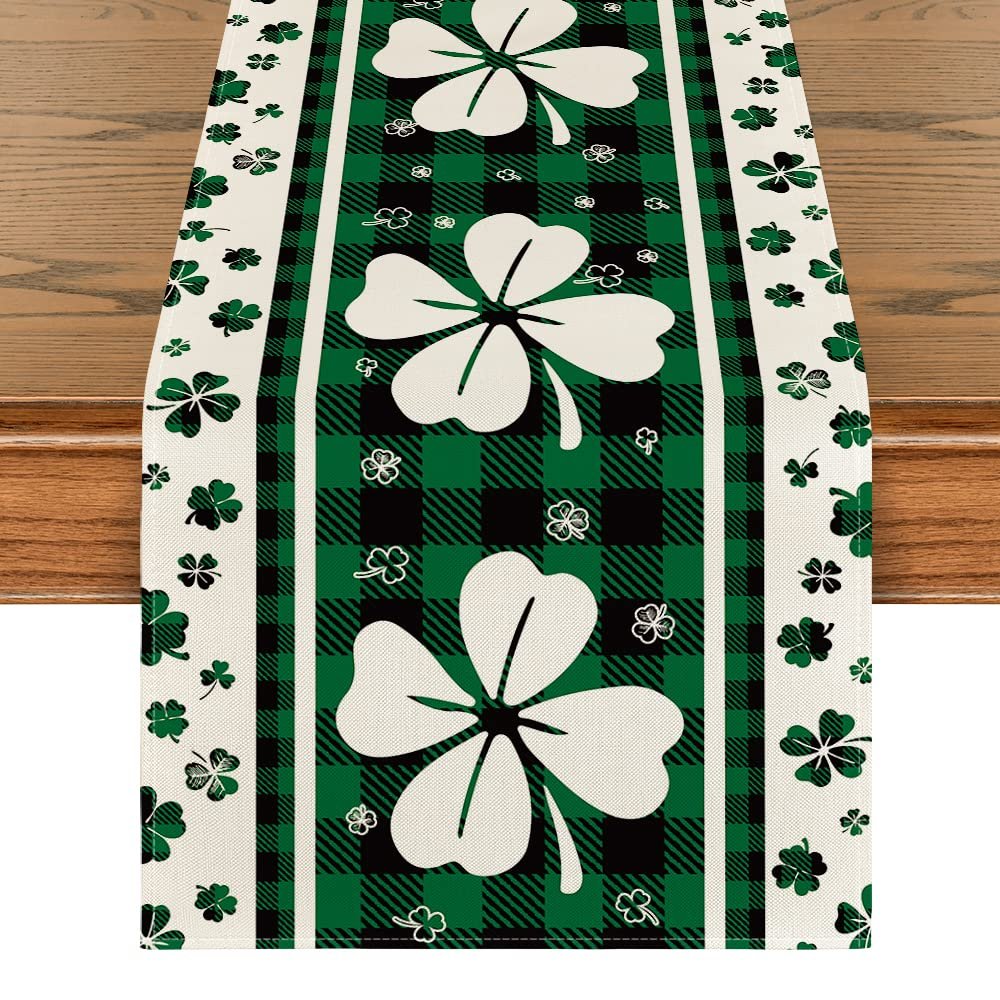 Green clover buffalo plaid St. Patrick's Day table runner on a wooden table, close-up view