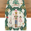 Christmas table runner with nutcracker, princess, mouse, and Christmas tree design on a wooden table.