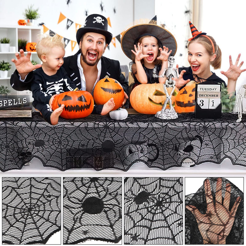 Family in Halloween costumes posing behind a black lace spider web table runner with pumpkins and decorations