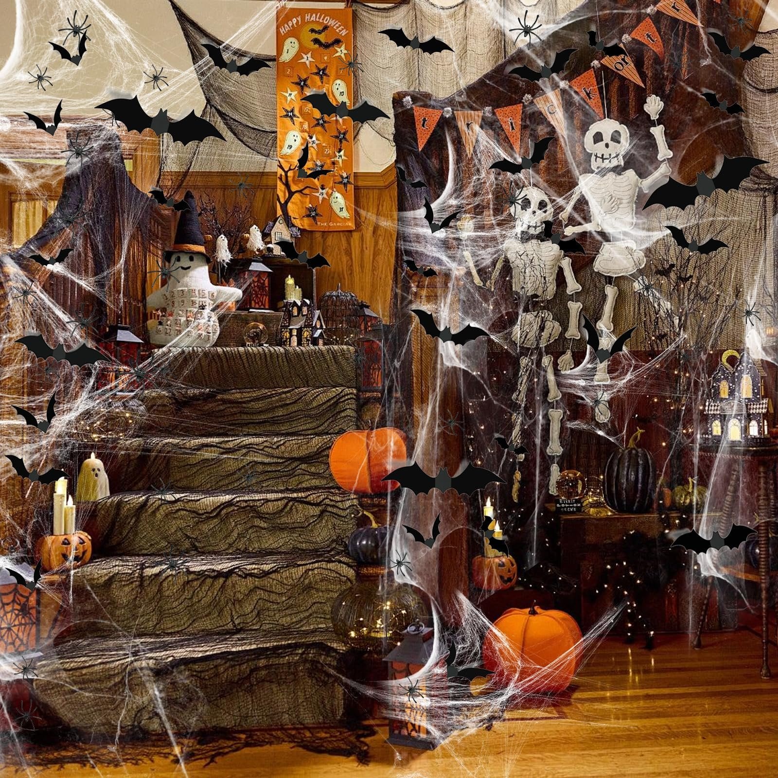 Halloween decorated staircase with fake spider webs, bats, skeletons, pumpkins, and candles.