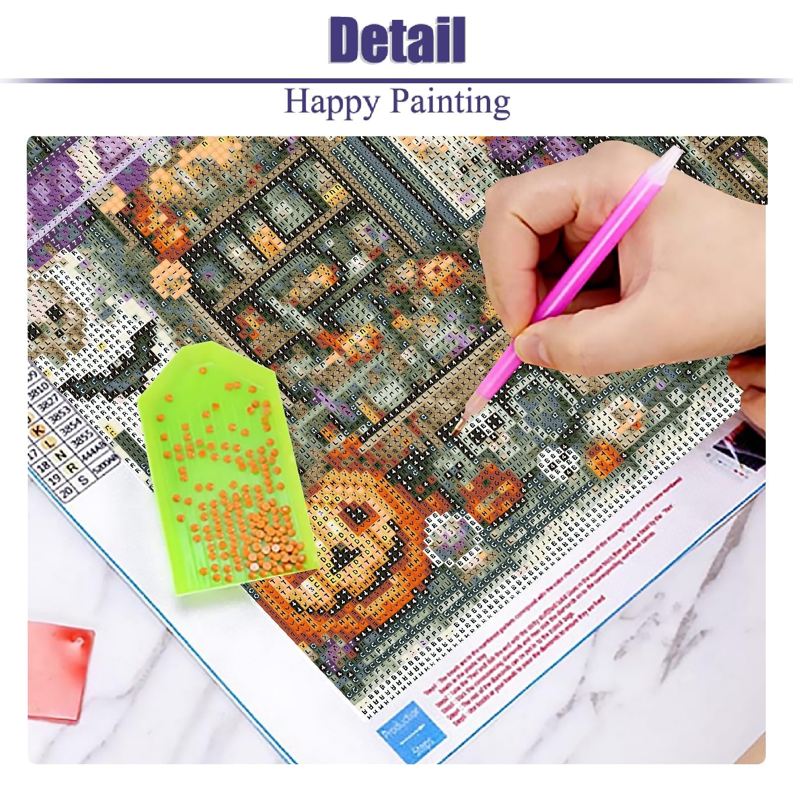 Close-up of a Halloween diamond painting kit in progress, showing a hand using a pink tool to place orange beads on a canvas depicting a vintage shop with a pumpkin.