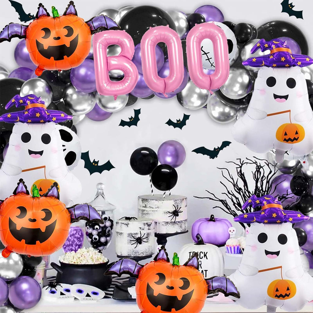 Halloween balloon decoration with pink BOO letters, ghost, and pumpkin shapes, set against a backdrop of black, purple, and silver balloons.