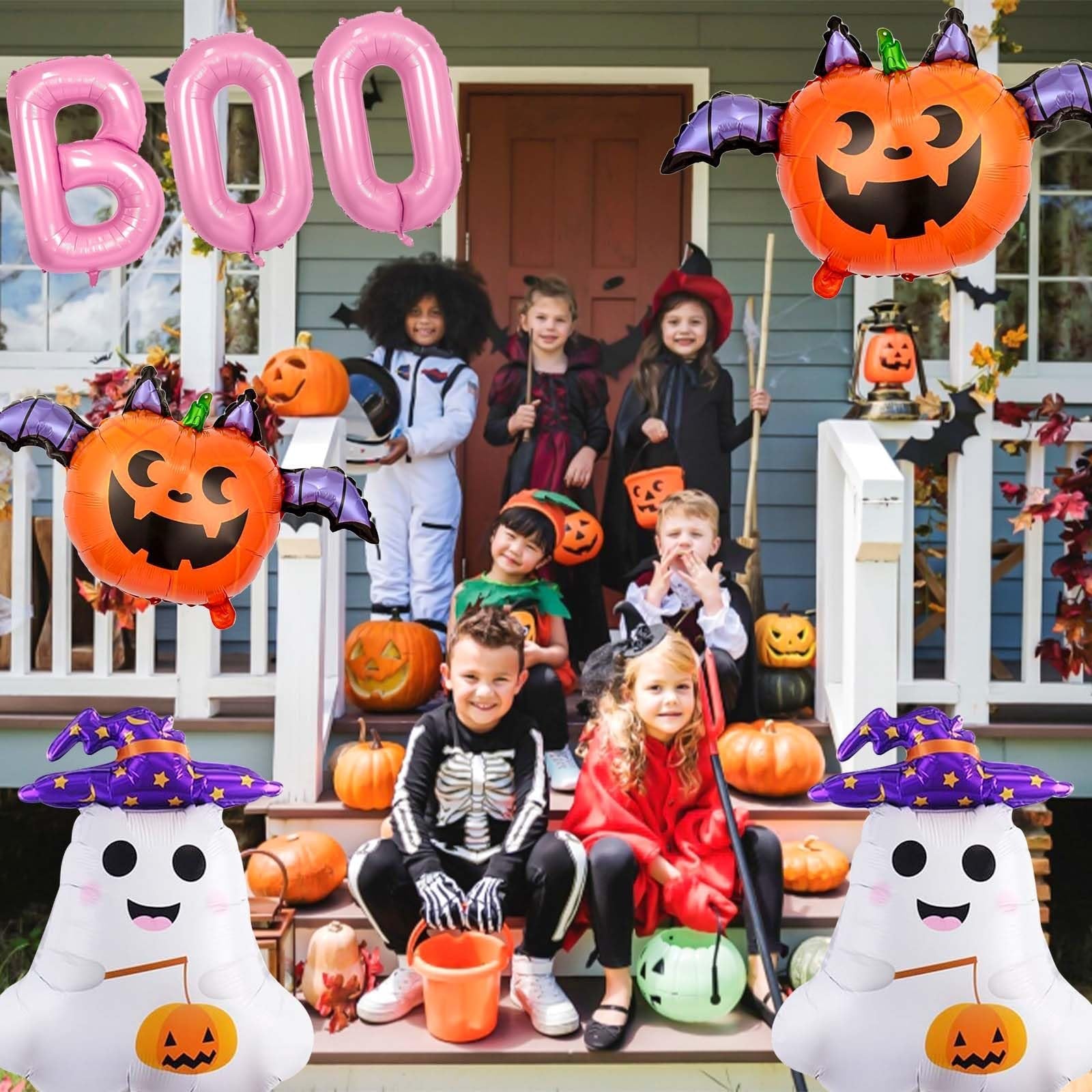 Children in Halloween costumes posing on porch with pink BOO balloons, ghost, and pumpkin balloons