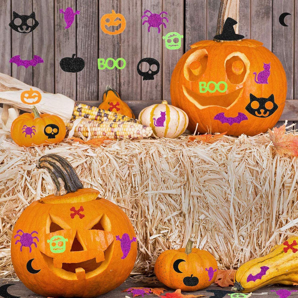 Halloween glitter foam stickers in various shapes like pumpkins, ghosts, and bats applied to carved pumpkins and gourds.