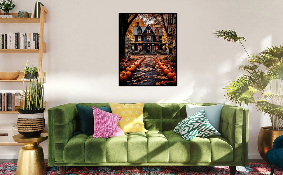 Halloween house with pumpkin-lined path painting displayed above a green sofa