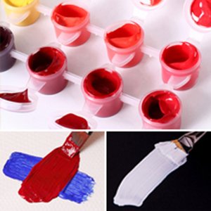 Paint by number kit with multiple small pots of acrylic paint and brushes with paint swatches.