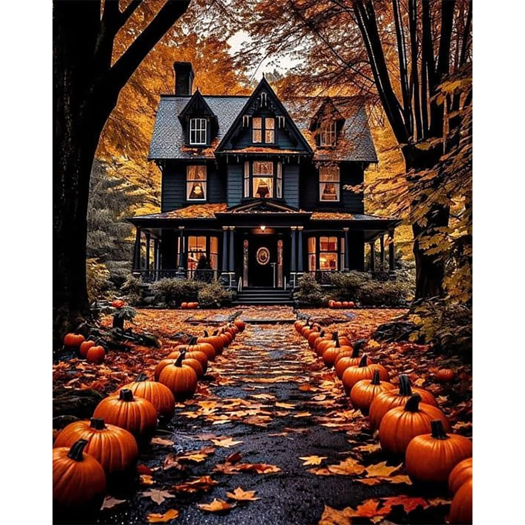 Halloween house with pumpkins lining a path, surrounded by autumn trees and fallen leaves.