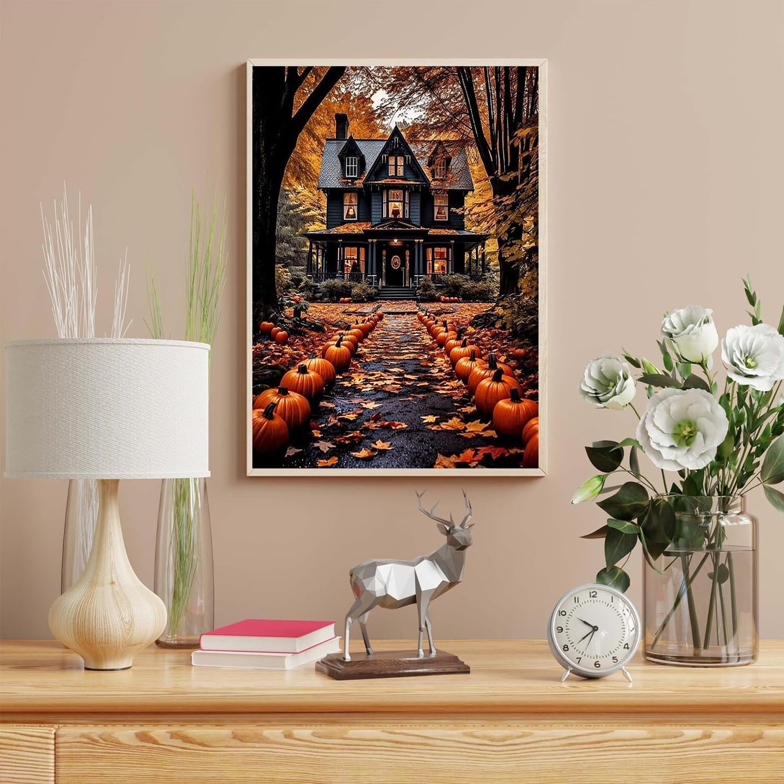 Paint by number canvas depicting a haunted house on a path lined with pumpkins and autumn leaves