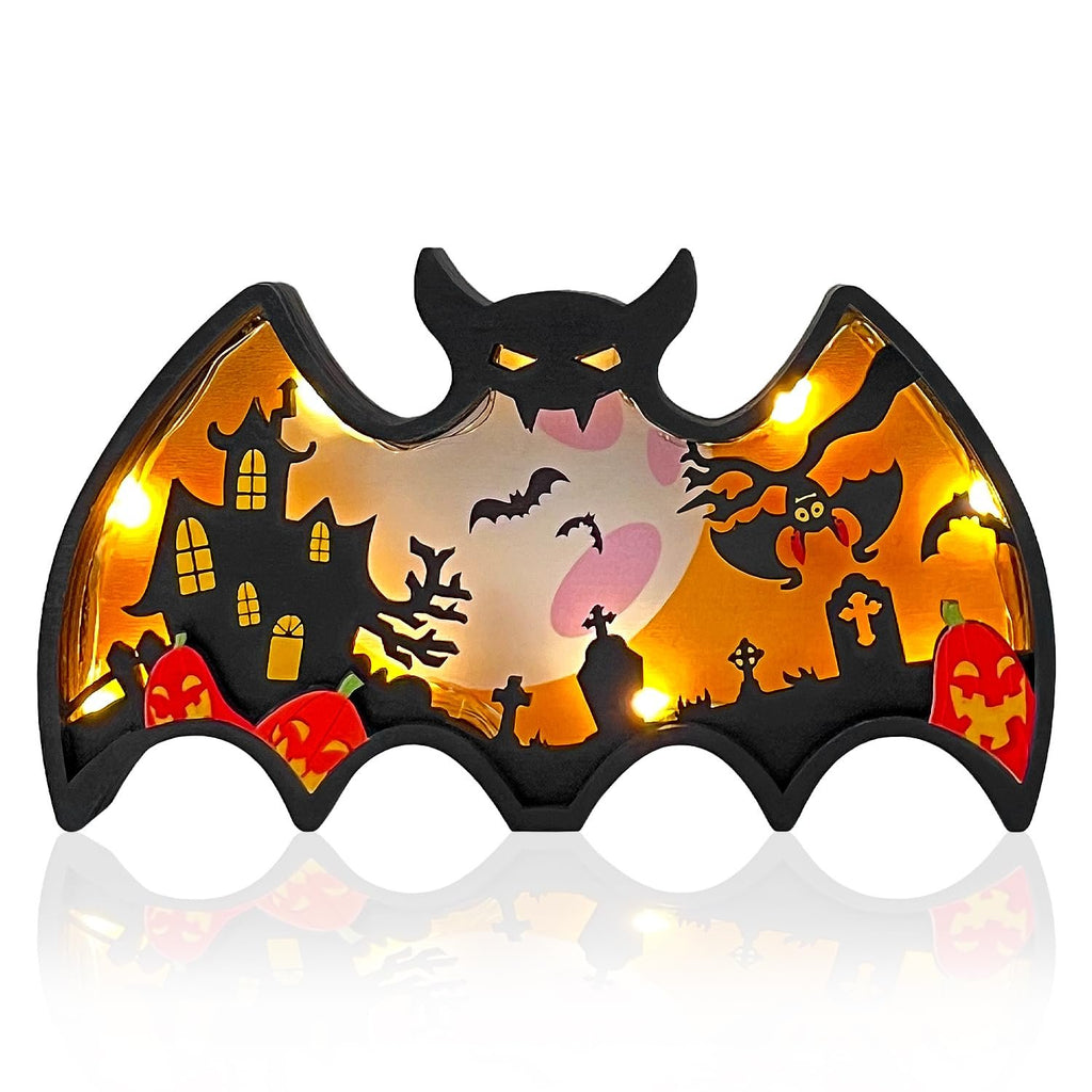 Light-up wooden bat shadow box with Halloween scene, including haunted house, pumpkins, and bats.